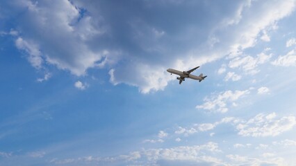 Airplane in the sky at sunset. Air transportation.  Travel. Airplane Takes Off Against the Background of Blue Sky. 