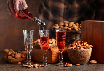Italian liqueur Amaretto with almonds nuts.
