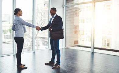 Handshake, deal and business people in office with partnership, agreement and b2b merger. Welcome, greeting and hr manager shaking hands with hiring candidate for corporate onboarding in workplace.