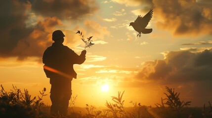 Silhouette of a soldier holding a dove of peace against a vibrant sunset, captured with a wide-angle lens in low-light conditions.