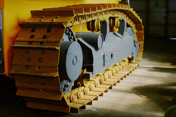 No people shot of gray and yellow undercarriage part of modern bulldozer, copy space