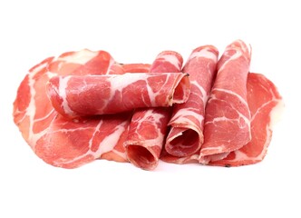 Freshly cut slices of Coppa or Capocollo on white background. It is traditional Italian pork cold cut made from the dry cured muscle of the neck. In USA is known as gabagool or capicola.