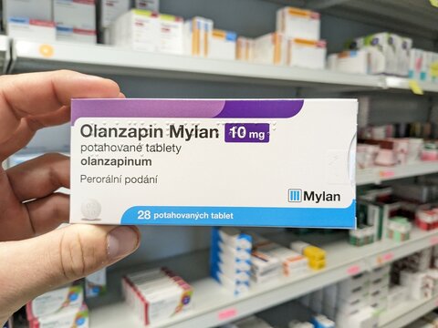 Prague,Czech Republic-July 9 2024: Olanzapin Mylan box of medication with Olanzapine active substance by Mylan,used for treatment of schizophrenia,bipolar disorder,psychosis,mood swings,agitation.