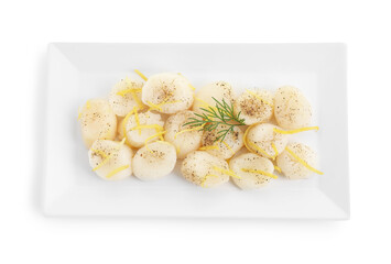 Raw scallops with milled pepper, dill and lemon zest isolated on white, top view