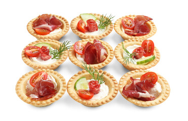 Delicious canapes with jamon, dry smoked sausages and vegetables isolated on white