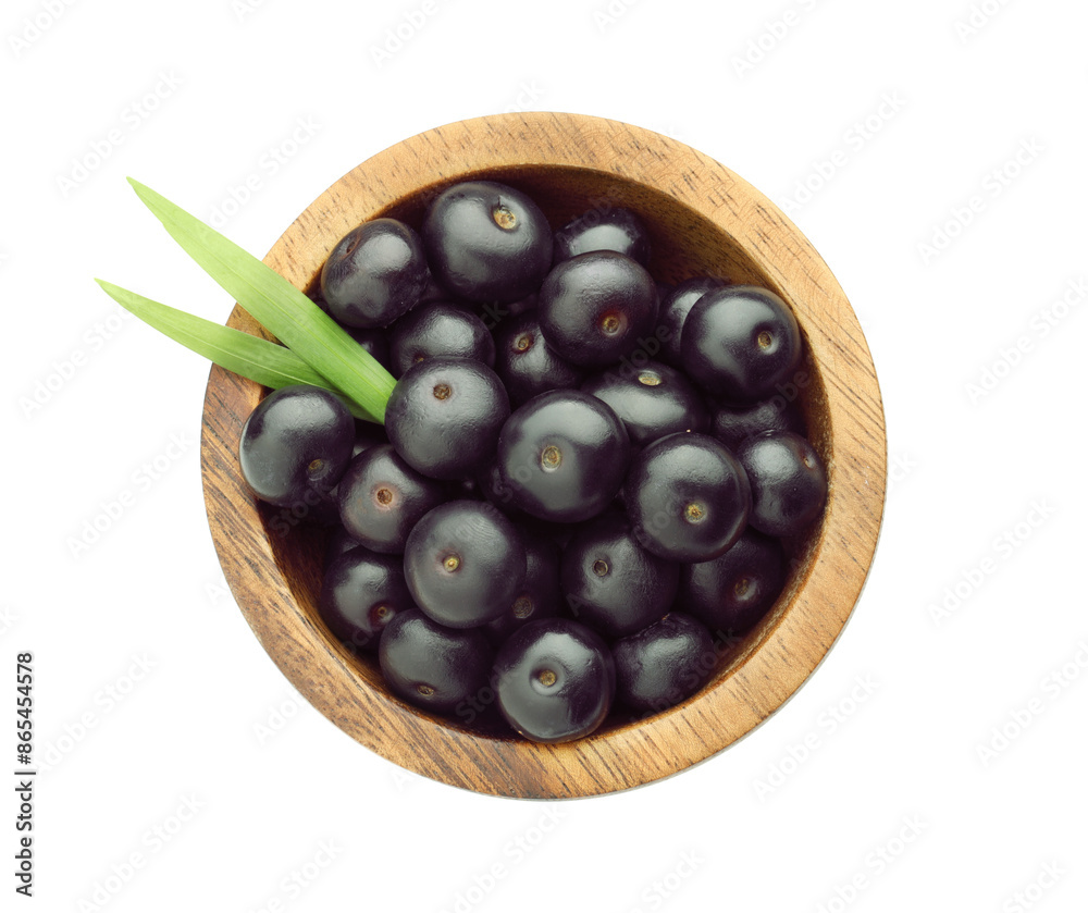 Wall mural fresh ripe acai berries in bowl and green leaves isolated on white, top view - Wall murals