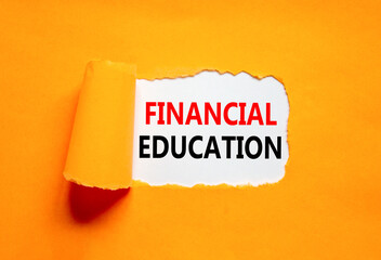 Financial education symbol. Concept words Financial education on beautiful white paper. Beautiful orange paper background. Business Financial education concept. Copy space.