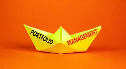 Portfolio management symbol. Concept words Portfolio management on beautiful yellow paper boat. Beautiful orange paper background. Business Portfolio management concept. Copy space.