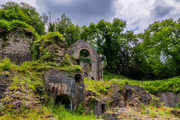 Overgrown ruins of the 1790s built ironworks in Clydach, South Wales, UK