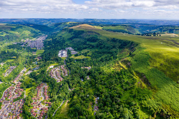 Obraz premium Aerial view of a South Wales Valleys town surrounded by green hills (Ebbw Vale)