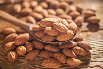 Almond in Wooden Spoon on a Rustic Table. Food Concept of Healthy Eating. Delicious Roasted Almond Nut, Vegan Food