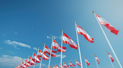 Austrian Flags Waving Against Clear Blue Sky - National Pride and Patriotism