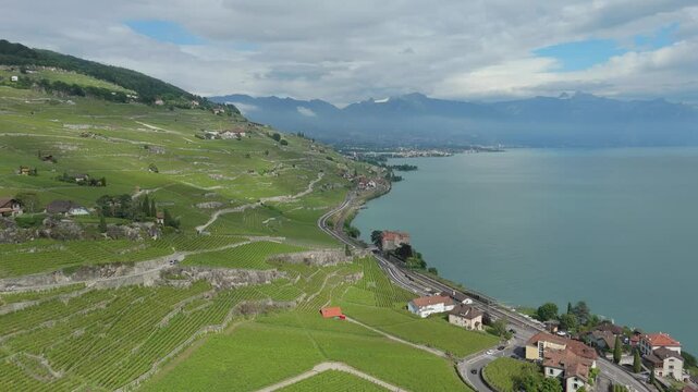 Lavaux wine region, Terrace vineyards located in Vaud from Lausanne to Vevey-Montreux. Lake Geneva in the background. Aerial Drone Video 4k Switzerland