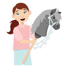 Little smiling girl interested in hobbyhorsing with a toy horse head