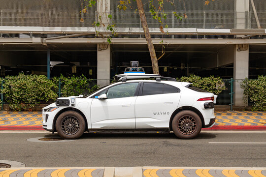Santa Monica, CA, US-May 23, 2024:  A Waymo driverless car parked on street.