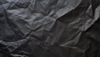 crumpled black office craft sheet paper, abstract minimalist luxury texture background wallpaper with space for copy and presentation, waste recycling
