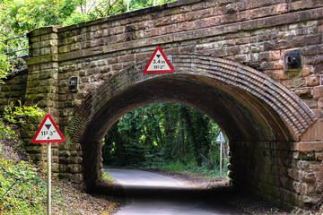 Historic stone bridge on countryside road for railway