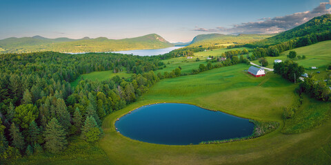 Overlooking Vermont Farm with pond and red barn