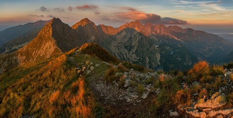 Wonderful panorama mountains with a hiking trail on the ridge. Picturesque places in Tatra Mountains in Poland. View on mountain ridge (Volovec Wolowiec) in Western Tatras. 