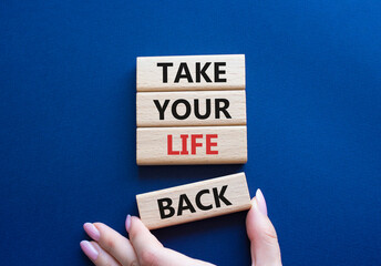 Take your life Back word symbol. Wooden blocks with words Take your life Back word. Psychologist hand. Beautiful deep blue background. Psychology and Take your life Back word. Copy space.