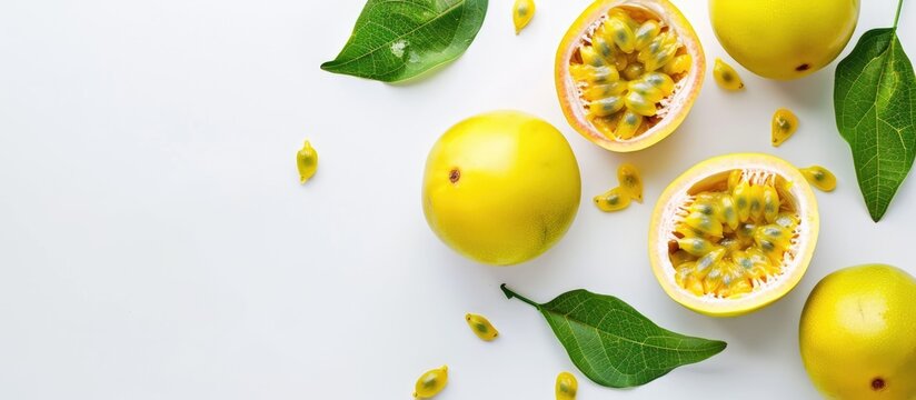 Isolated yellow passion fruit with leaf on white background with space for text, viewed from above.