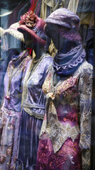 Fototapeta premium Elegant Vintage Dresses and Hats in Boutique Window Display