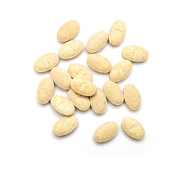 Brown pills, medicine isolated on white background, top view
