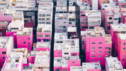 a view of a city with a lot of pink buildings
