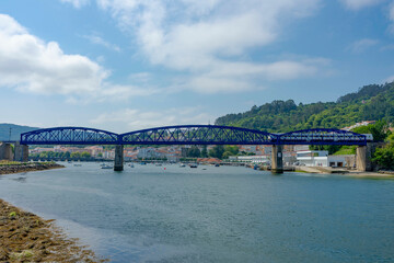 Naklejka premium Noon train over steel bridge