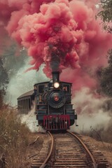 Vintage steam powered railway train in red smoke
