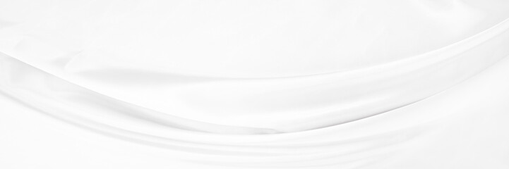 White gray satin texture that is white silver fabric silk background with beautiful soft blur...