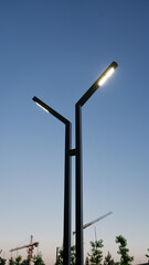 Modern, minimalistic street lamp in the evening