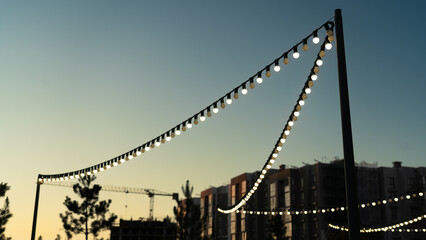 Lanterns in a modern area in the evening with a sunset sky