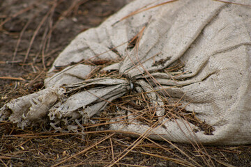 heavy white bag of sand on ground