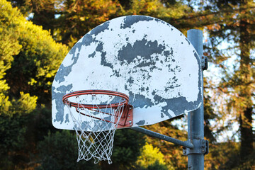 weathered basketball hoop up close © Elizabeth