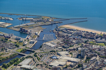 Aerial helicopter views over Swansea, Mumbles and the Gower Peninsular, Wales, UK
