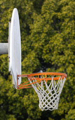 weathered basketball hoop and backboard up close © Elizabeth