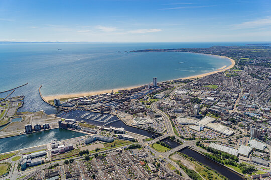 Aerial helicopter views over Swansea, Mumbles and the Gower Peninsular, Wales, UK
