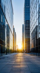 Fototapeta premium Sunset in a modern business district with glass office buildings. Corporate skyline and urban development concept
