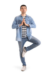 Young man meditating on white background. Balance concept