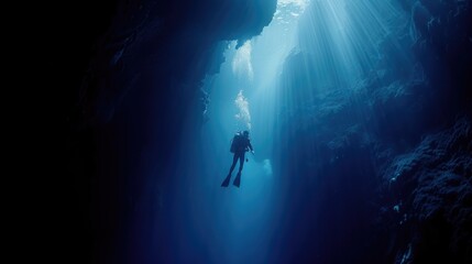 Diver underwater in the blue sea. Scuba diving in the depths of the sea