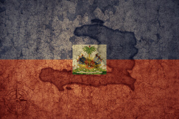 map and flag of haiti on a old vintage crack paper background .