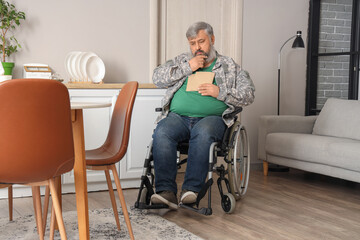 Portrait of sad senior veteran in wheelchair with letters at home