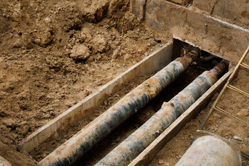 Water pipe replacement. Reconstruction of the underground sewer system in city street. Elimination of the accident on the underground pipeline. Installation of new pipes and valves. Industrial concept