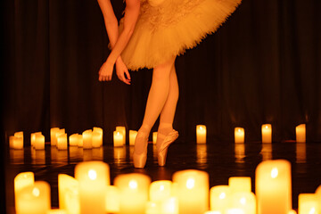 balerina dancing on stage with lots of candles © Ruslan