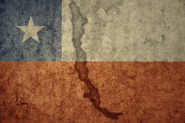 map and flag of chile on a old vintage crack paper background .
