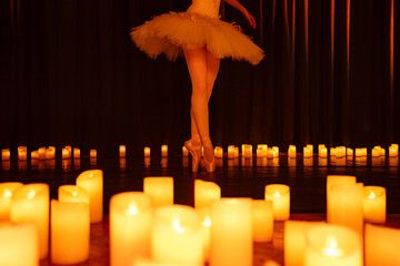 balerina dancing on stage with lots of candles © Ruslan