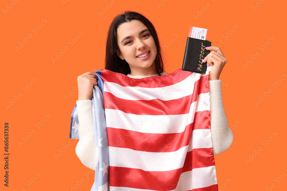 Poster beautiful young happy woman with usa flag, passport and ticket on orange background