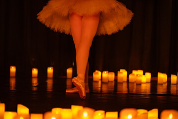 balerina dancing on stage with lots of candles © Ruslan