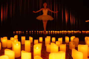 balerina dancing on stage with lots of candles © Ruslan